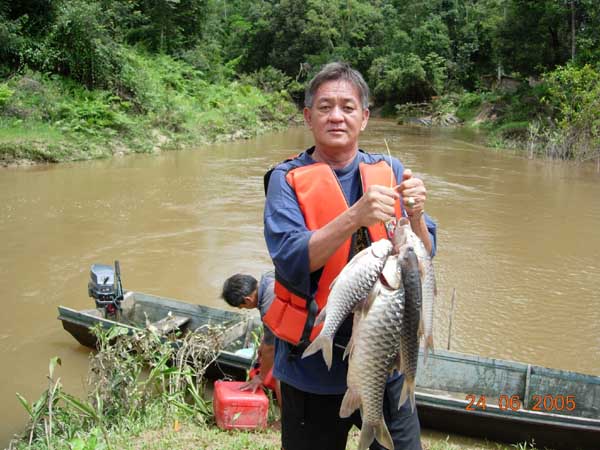 Robert Chee enjoys fishing in the Bario Highlands